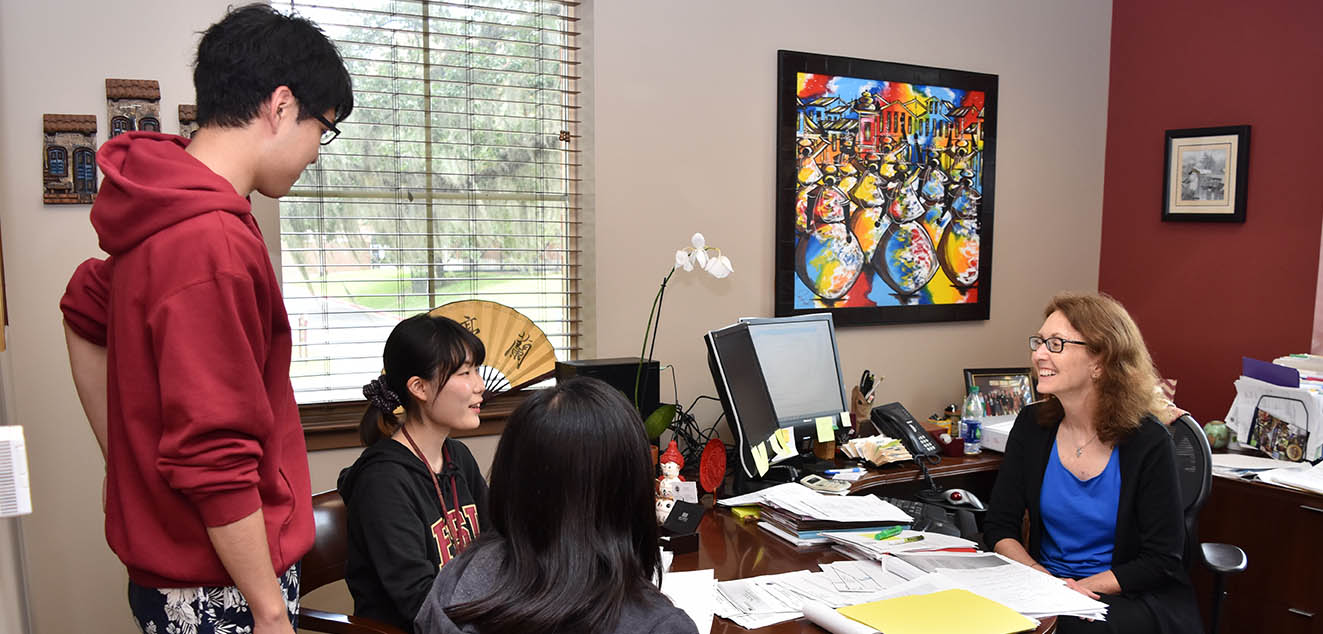 FSU students meeting with advisor.