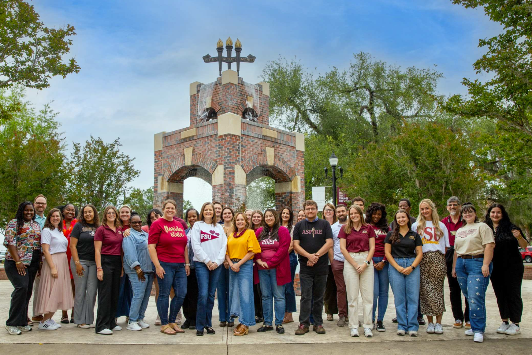 Admissions staff in front of the Three Torches Fountain at FSU.