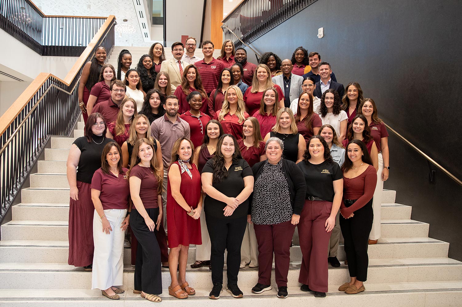 Admissions staff in front of the Three Torches Fountain at FSU.