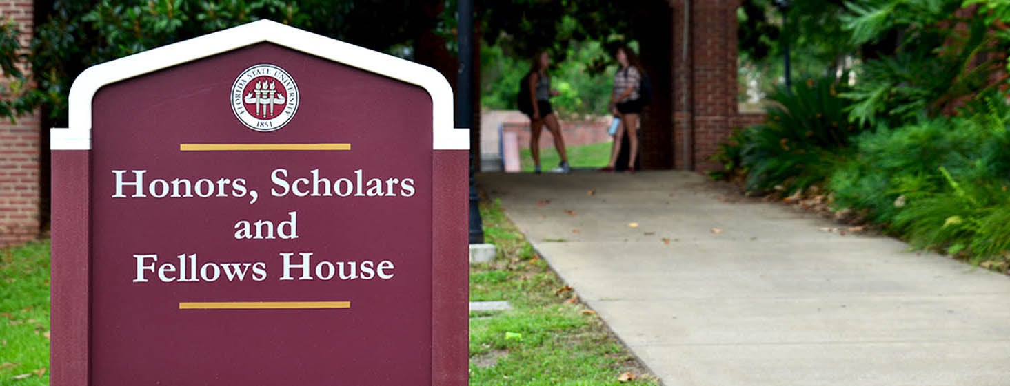 Image of a sign at FSU that says 'Honors, Scholars and Fellows House'.